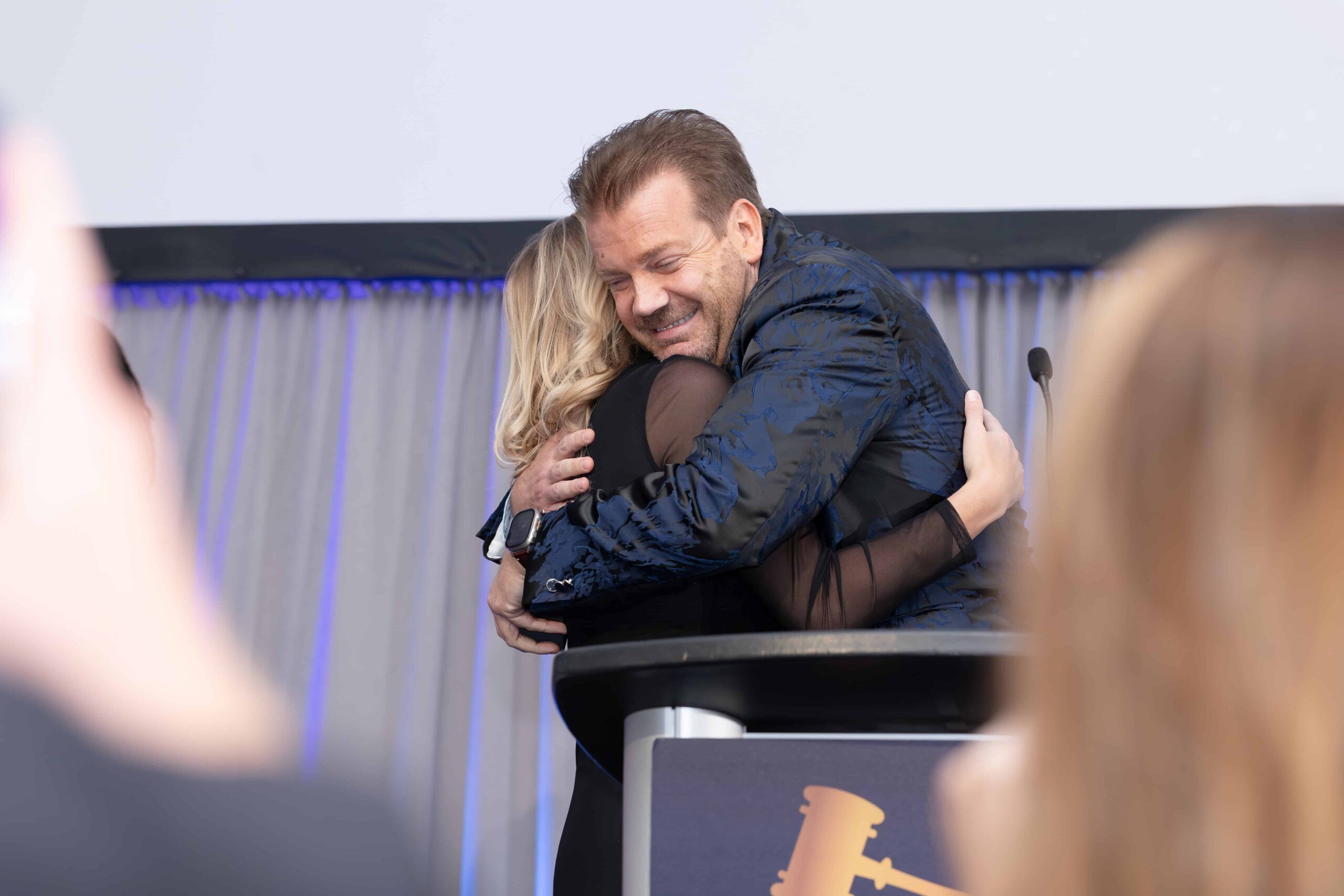Golden Gavel Awards 2026 (193 of 275) (1) people huggging on stage