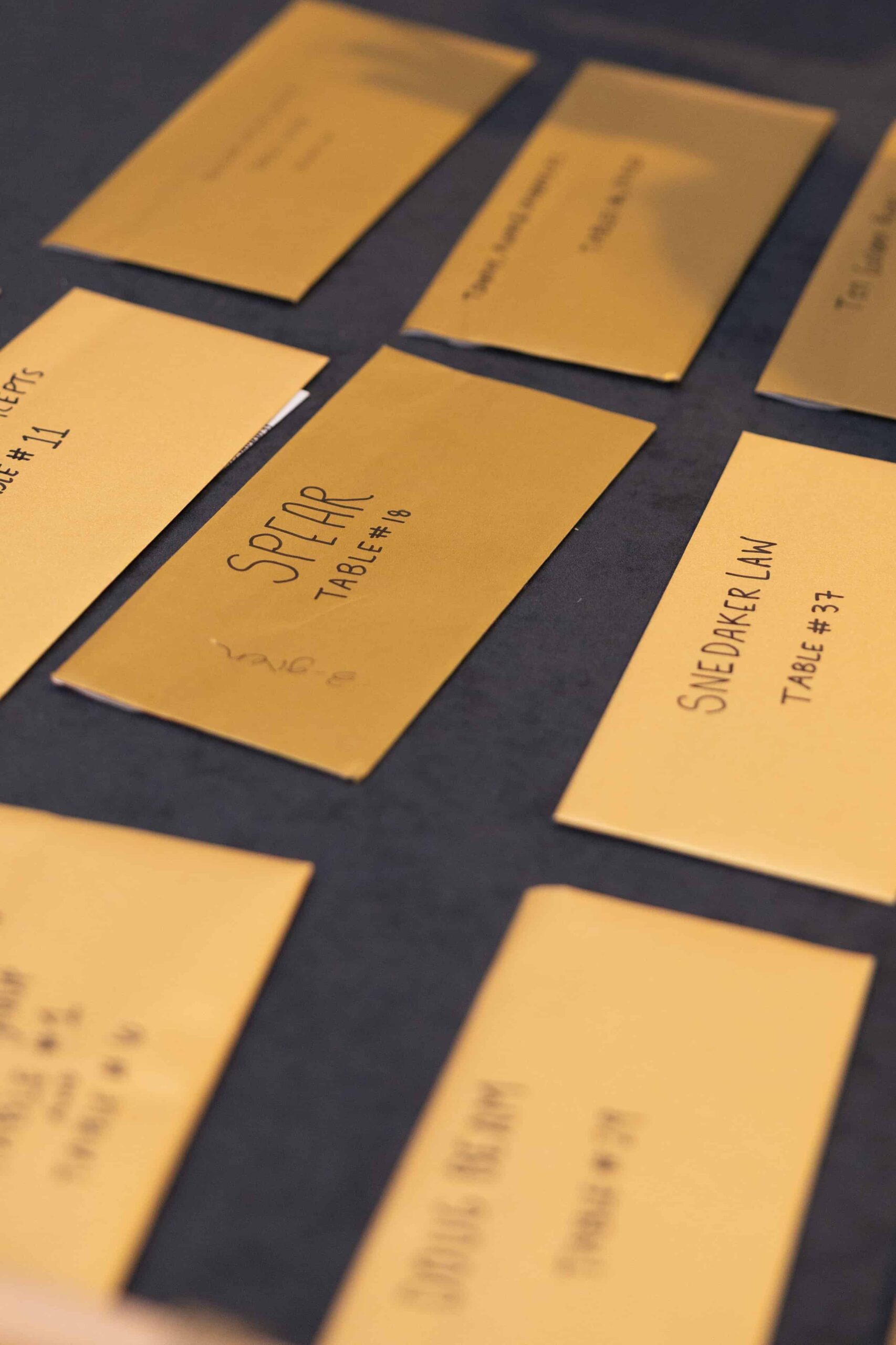 various name cards on a table at the golden gavel evenr